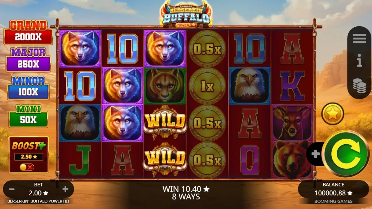 Twee WILD-buffels op rol 3 met een kolom muntvermenigvuldigers (0,5× en 1×) ernaast; het scherm meldt WIN 10,40 · 8 WAYS. Links de jackpotladder GRAND 2000×.
